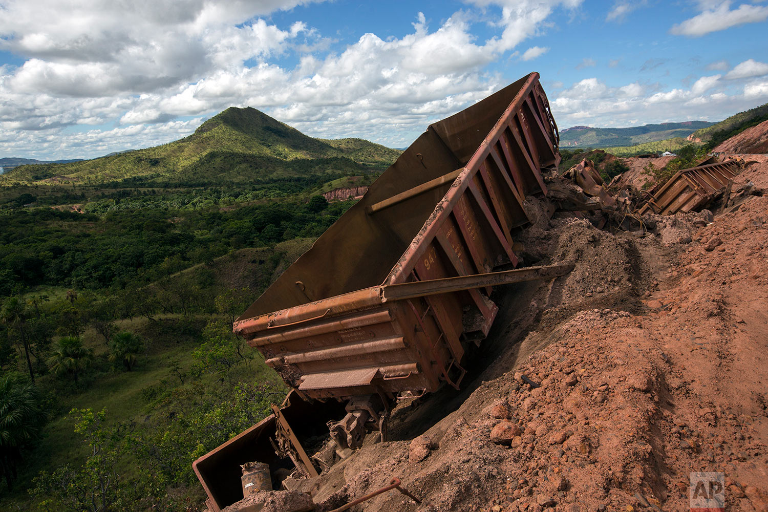  In this Nov. 2, 2017 photo, twisted and derailed wagons that used to carry iron ore lie askew at Ferrominera Orinoco, in Ciudad Piar, Bolivar state, Venezuela. The cars derailed when an engineer was traveling too fast on rails left unmaintained. (AP