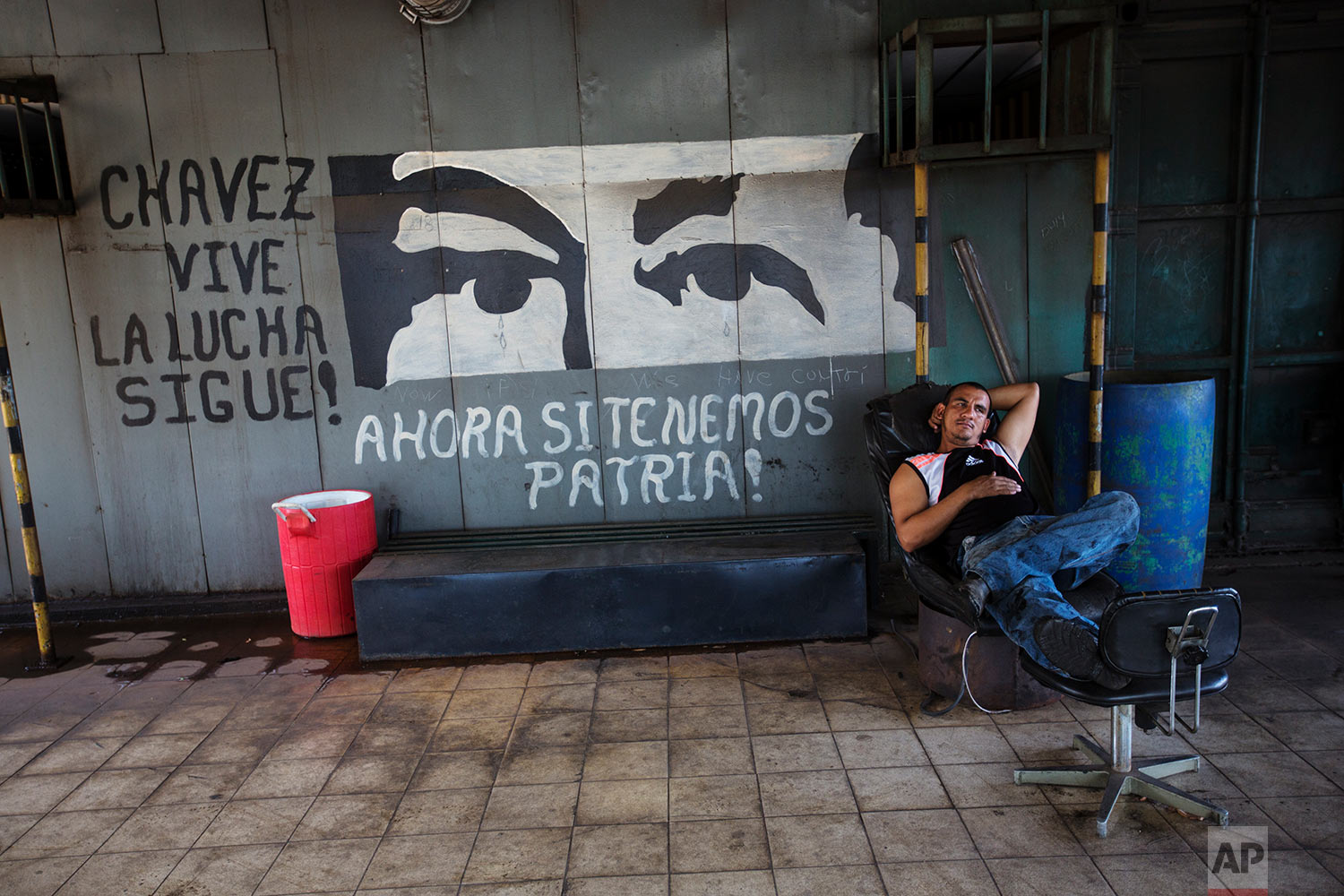  In this Nov. 7, 2017 photo, Jesus Itriago rests after lunch, at the Sidor steel plant, in Ciudad Guayana, Bolivar state, Venezuela. In 2008 Venezuelan President Hugo Chavez began putting the factories, then owned by conglomerates from Japan and Arge