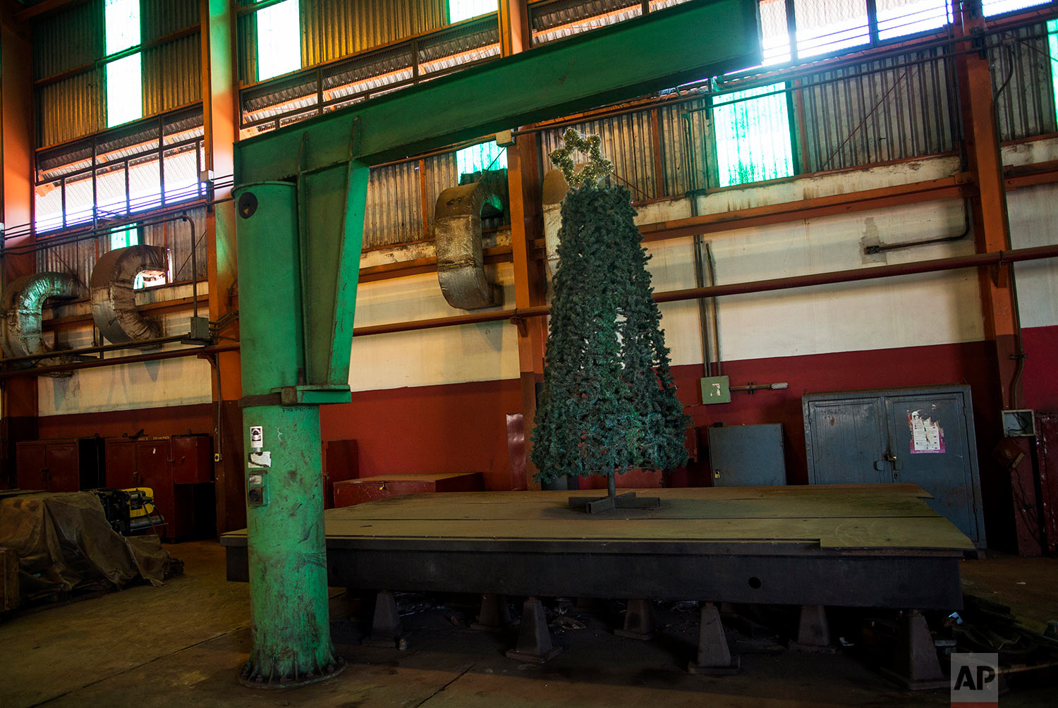  In this Nov. 3, 2017 photo, a Christmas tree decorates the Pellas steel plant in Ciudad Guayana, Bolivar state, Venezuela. Years of neglect and mismanagement have left in decay Ciudad Guayana, a once-thriving would-be Pittsburgh carved from the jung