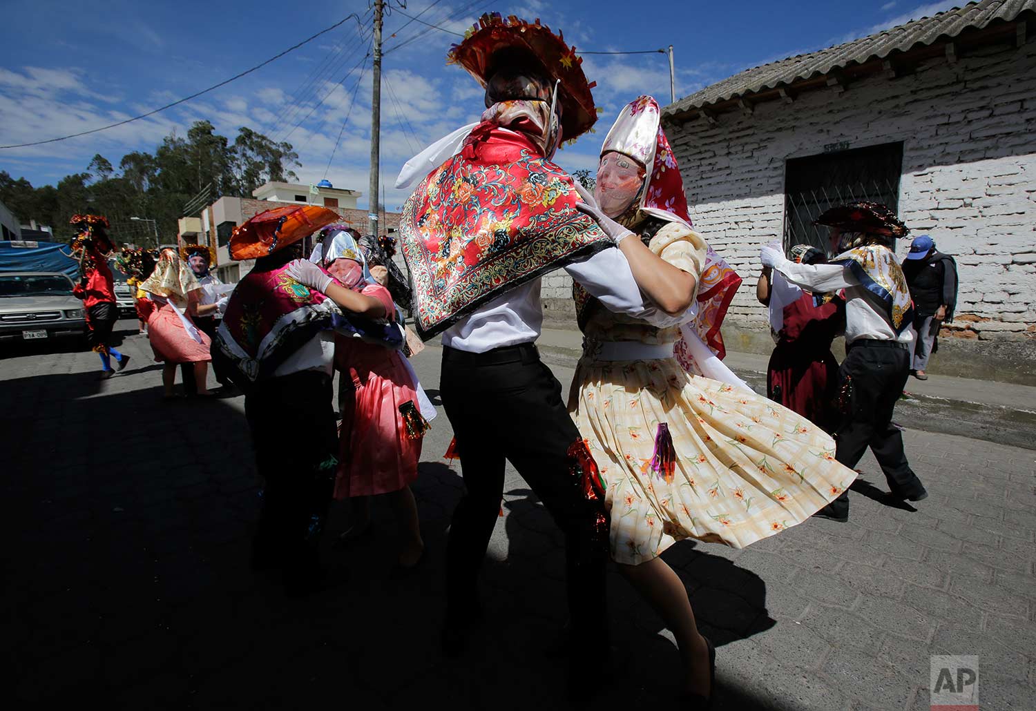  Couples representing the more affluent line dance during the traditional New Year's festival known as "La Diablada", in Pillaro, Ecuador, Friday, Jan. 5, 2018. (AP Photo/Dolores Ochoa) 