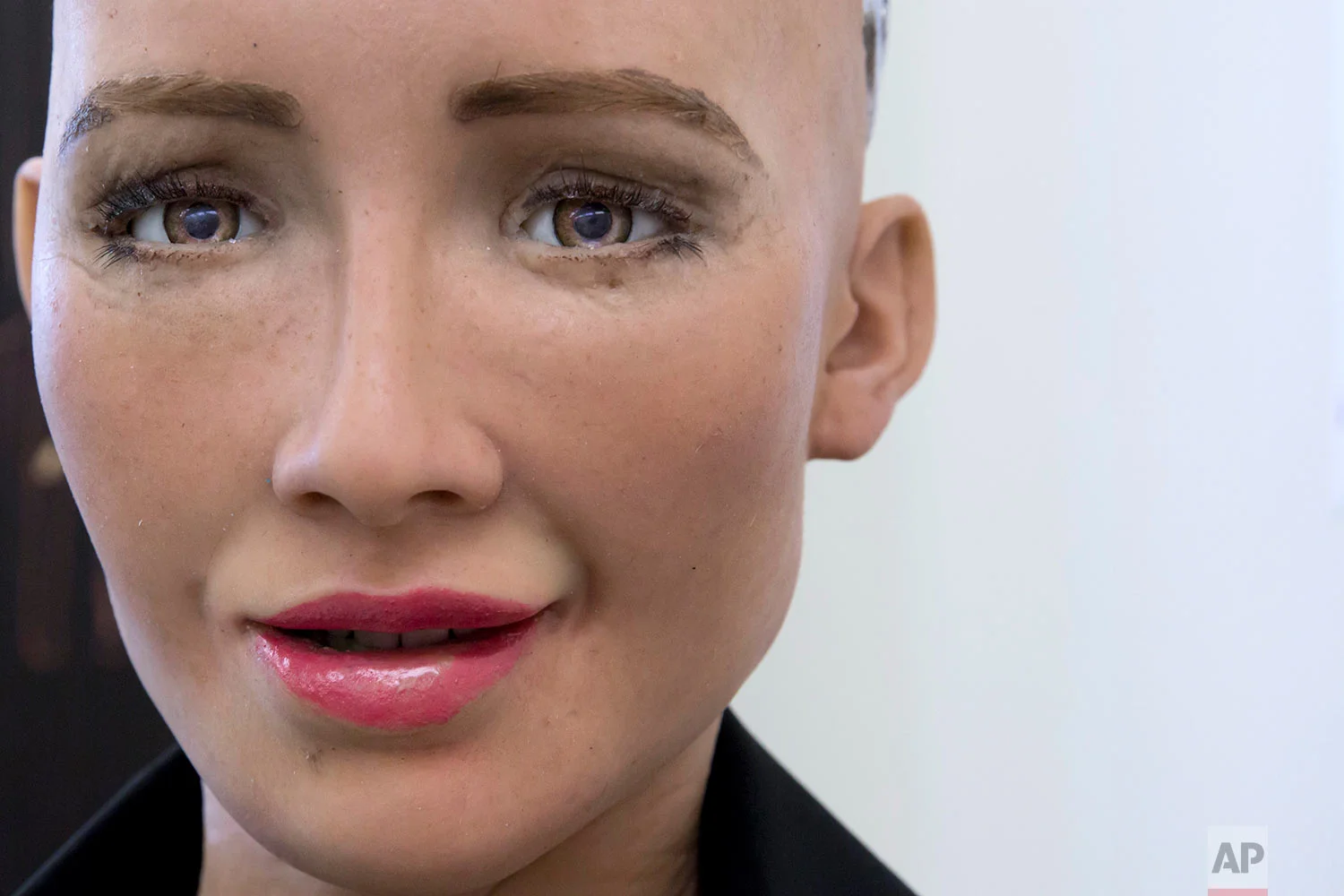 In this Sept. 28, 2017 photo, Hanson Robotics's flagship robot Sophia, a lifelike robot powered by artificial intelligence (AI) speaks in Hong Kong. (AP Photo/Kin Cheung) | See these photos on AP Images