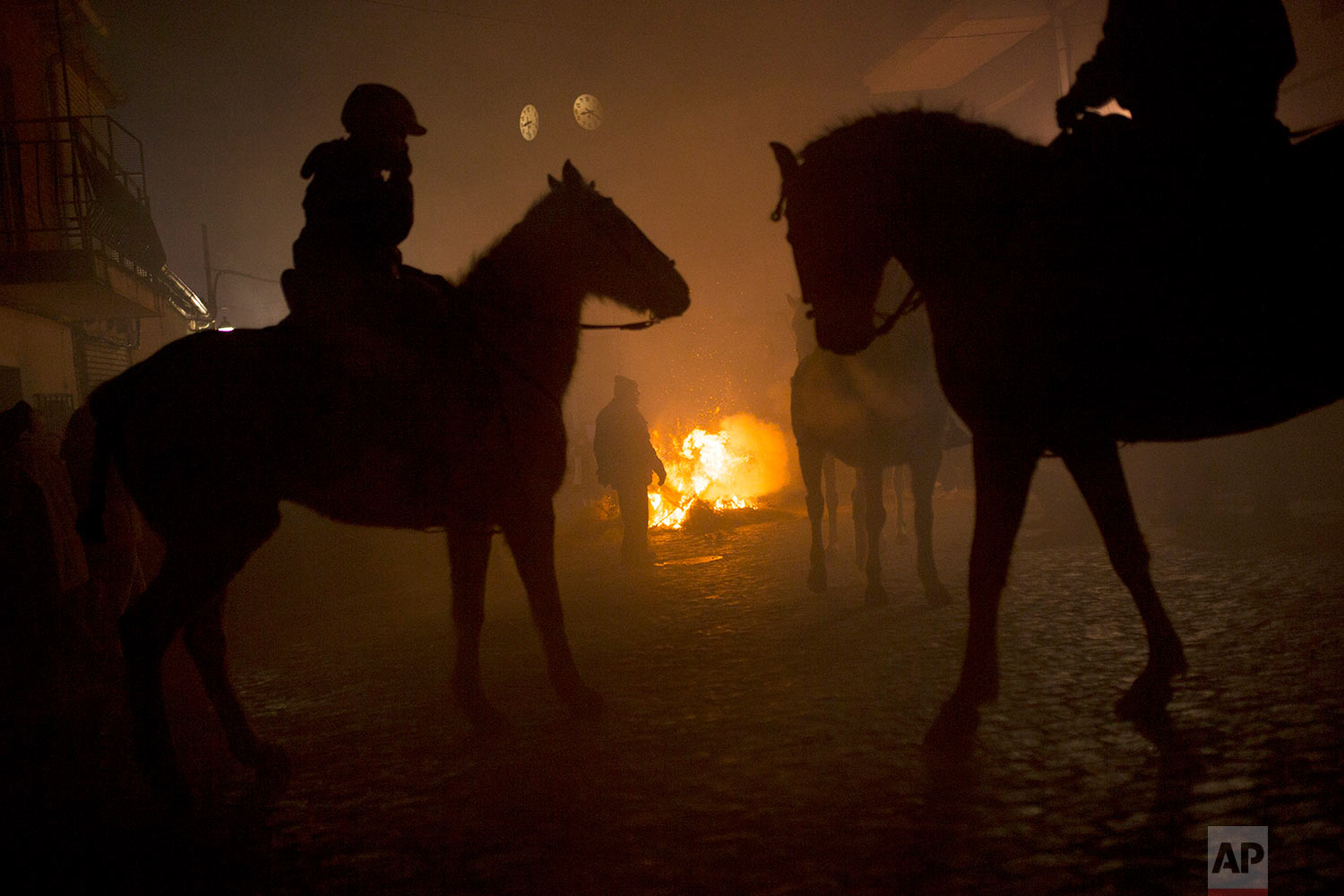  Riders and horses stand by bonfires prior the ritual in honor of Saint Anthony the Abbot, the patron saint of animals, in San Bartolome de Pinares, Spain, Tuesday, Jan. 16, 2018. (AP Photo/Francisco Seco)&nbsp;|&nbsp; See these photos on AP Images  