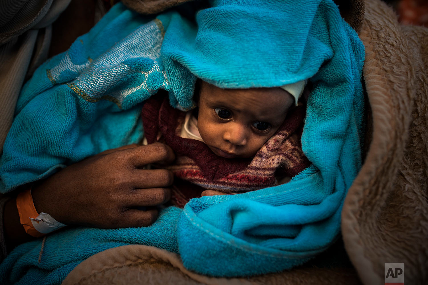  In this Thursday, Jan. 18, 2018 photo a Sub-Saharan baby rests aboard the Spanish NGO Proactiva Open Arms vessel after being rescued off the Libyan coast when they were trying to reach European soil, north of Sabratha, Libya. (AP Photo/Santi Palacio