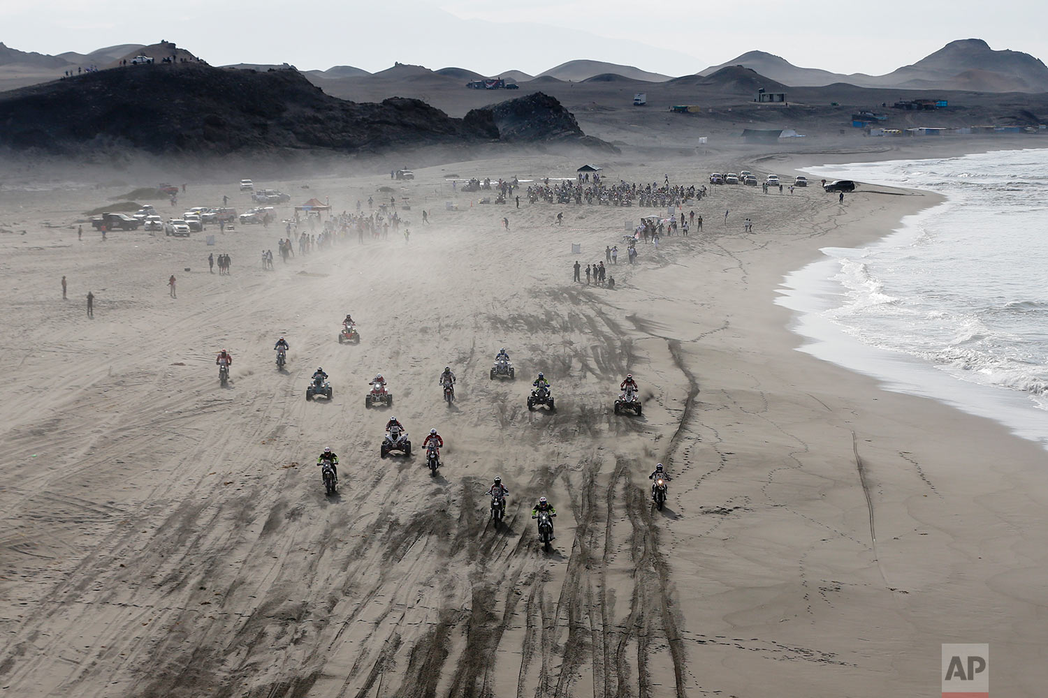  In this Tuesday, Jan. 9, 2018 photo, motorbikes and quads leave tracks along the beach during the 4th stage of the Dakar Rally in San Juan de Marcona, Peru. (AP Photo/Ricardo Mazalan)|&nbsp; See these photos on AP Images  