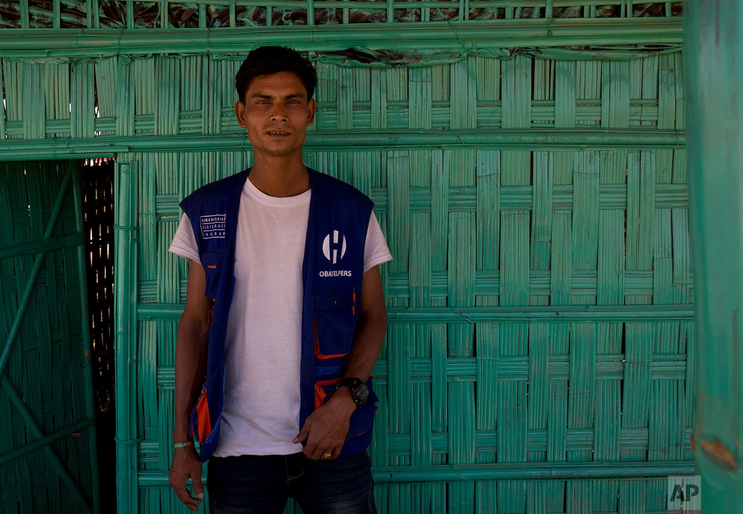 In this Tuesday, Jan. 23, 2018, photo, Mohammad Younus, 30, who is second time refugee poses for a photograph at BaluKhali refugee camp 50 kilometres (32 miles) from, Cox's Bazar, Bangladesh. Younus says “The Buddhists were torturing us, beating us and cutting us up. My parents couldn’t take it so they came here." (AP Photo/Manish Swarup) | See these photos on AP Images 