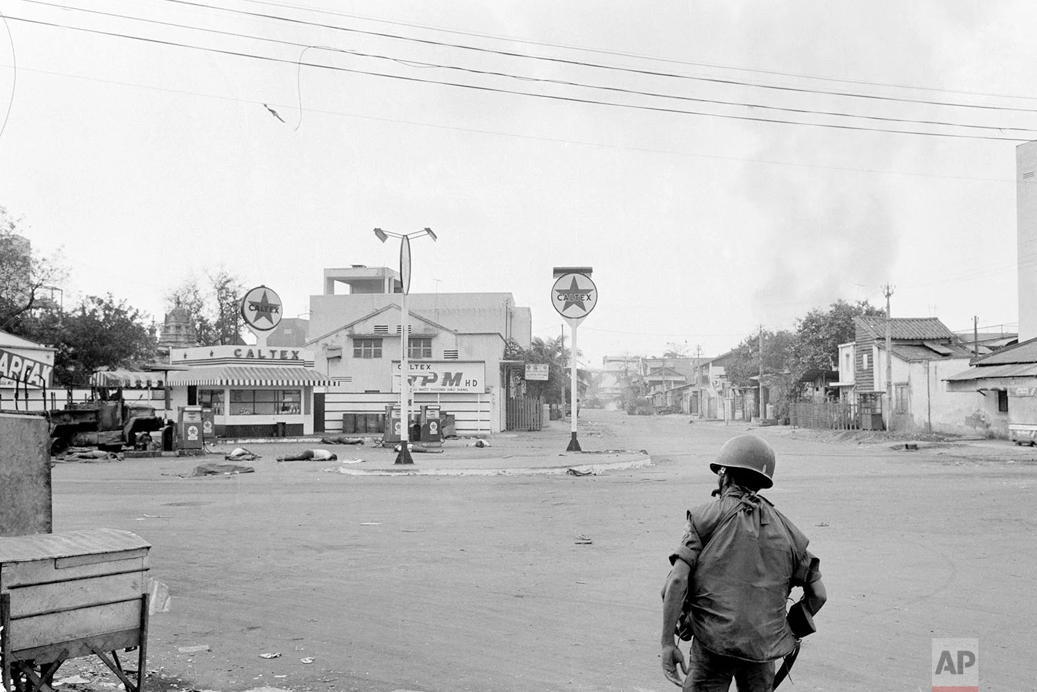 ** EDITORS NOTE: GRAPHIC CONTENT ** The bodies of some of the seven blindfolded people executed by the Viet Cong lie near gas pumps in the Cholon section of Saigon during the Tet Offensive on Feb. 9, 1968. The area had not yet been secured to recover the bodies. (AP Photo/Eddie Adams)