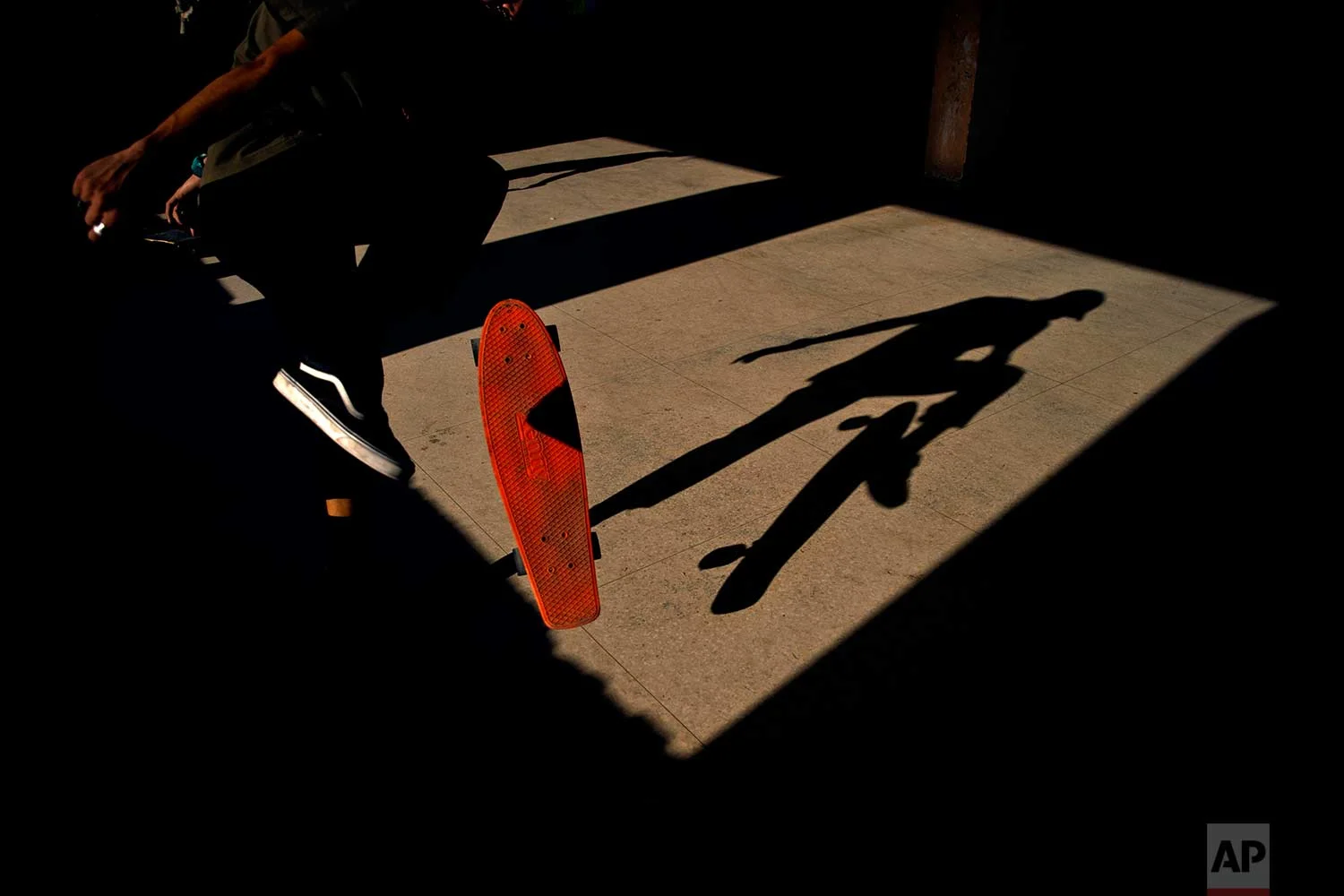 In this Jan. 11, 2018 photo, a skater trains inside an abandoned gym that was converted into a recreational space for skateboarders, the day of its inauguration inside the Educational complex Ciudad Libertad, a former military barracks that the late Fidel Castro turned into a school complex after the revolution in Havana, Cuba. (AP Photo/Ramon Espinosa)