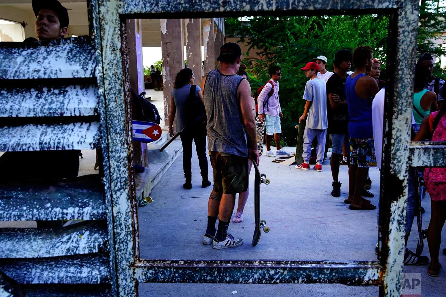 In this Jan. 11, 2018 photo, skaters gather for the inauguration of a new recreational space for skateboarders, created in an abandoned gym at the Educational complex Ciudad Libertad, a former military barracks that the late Fidel Castro turned into a school complex after the revolution in Havana, Cuba. (AP Photo/Ramon Espinosa)