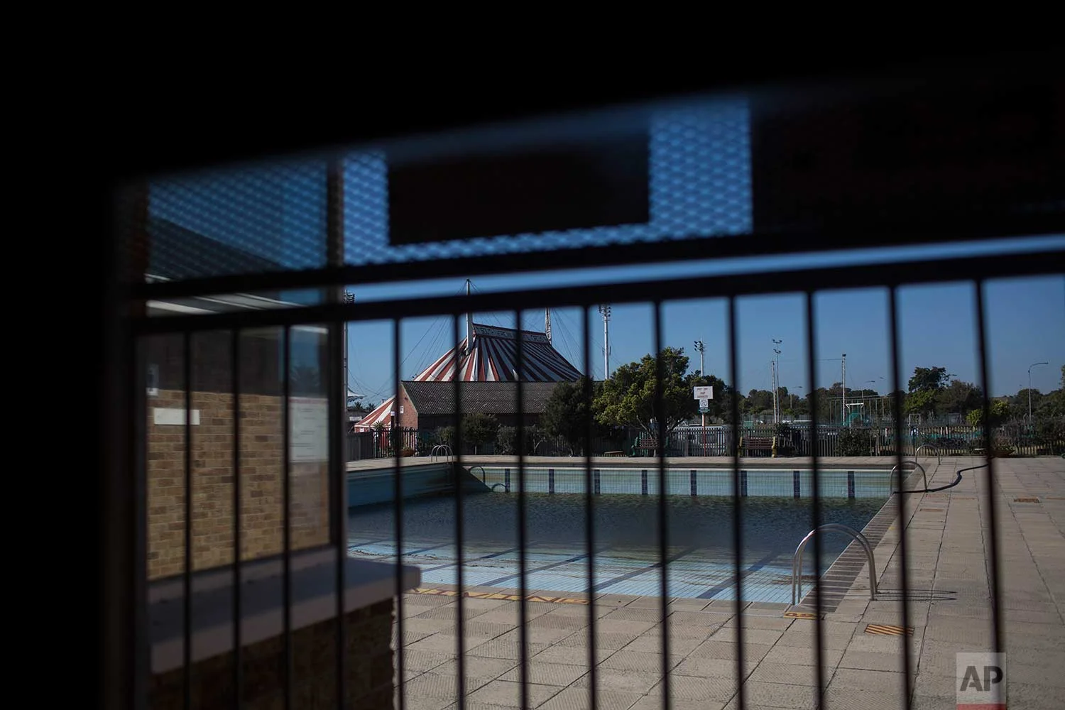 In this Thursday, Feb. 1, 2018, a public pool in Cape Town has been closed for months due to a lack of water in the city. (AP Photo/Bram Janssen)