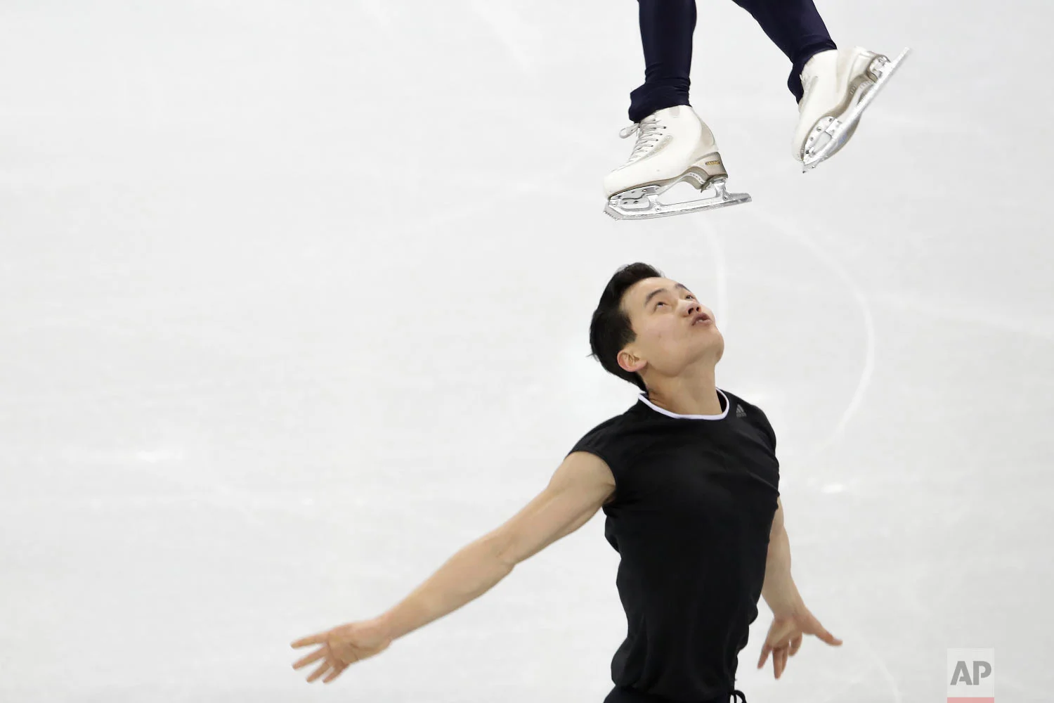 North Korea's Ryom Tae Ok and Kim Ju Sik, perform during a Pairs Figure Skating training session prior to the 2018 Winter Olympics in Gangneung, South Korea, Sunday, Feb. 4, 2018. (AP Photo/Felipe Dana)