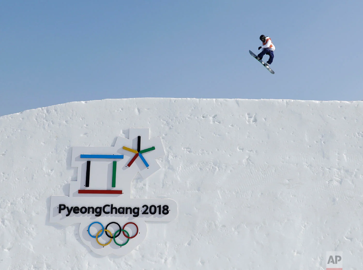A snowboarder trains ahead for the 2018 Winter Olympics in Pyeongchang, South Korea, Thursday, Feb. 8, 2018. (AP Photo/Gregory Bull)