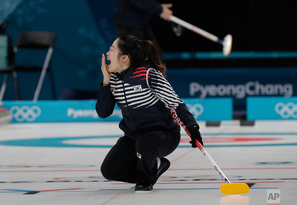  South Korea's Jang Hyeji react during the mixed doubles training session ahead of the 2018 Winter Olympics in Gangneung, South Korea, Wednesday, Feb. 7, 2018. (AP Photo/Aaron Favila) 