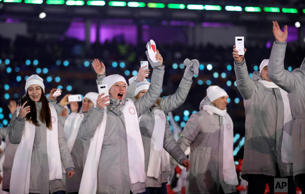  Russian athletes wave during the opening ceremony of the 2018 Winter Olympics in Pyeongchang, South Korea, Friday, Feb. 9, 2018. (AP Photo/Vadim Ghirda) 