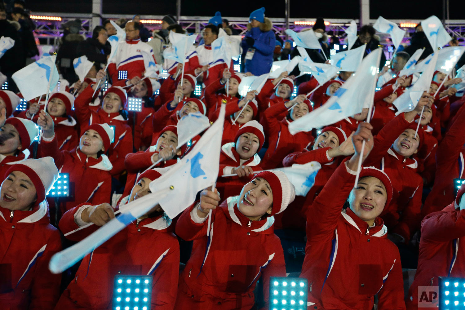  Members of the North Korean delegation wave flags of the combined Koreas before the opening ceremony of the 2018 Winter Olympics in Pyeongchang, South Korea, Friday, Feb. 9, 2018. (AP Photo/Natacha Pisarenko) 