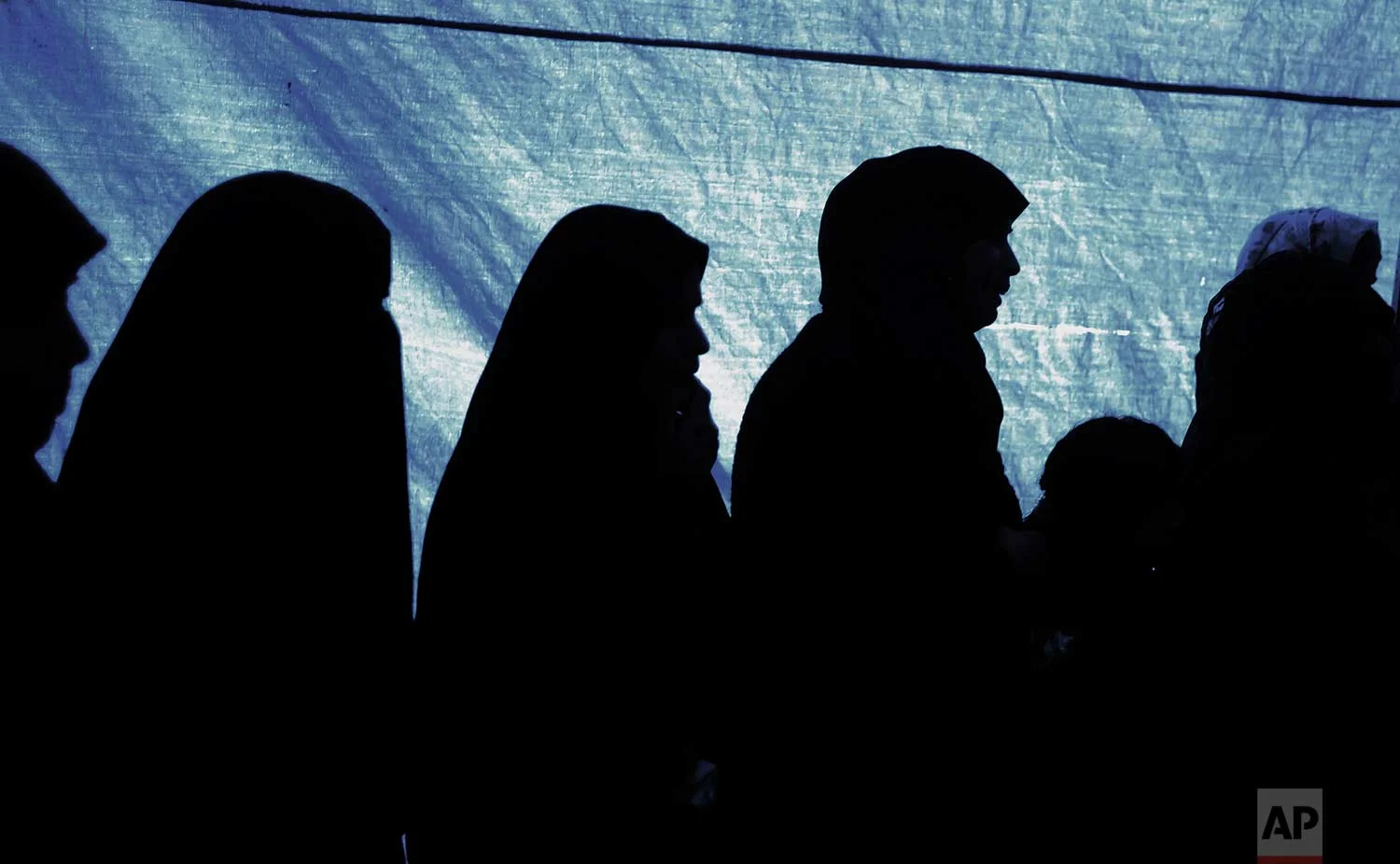 Relatives of 16-year-old Palestinian, Amir Abu Musaed, mourn during his funeral in the Maghazi refugee camp, central Gaza Strip, Friday, Jan. 12, 2018. (AP Photo/ Khalil Hamra)