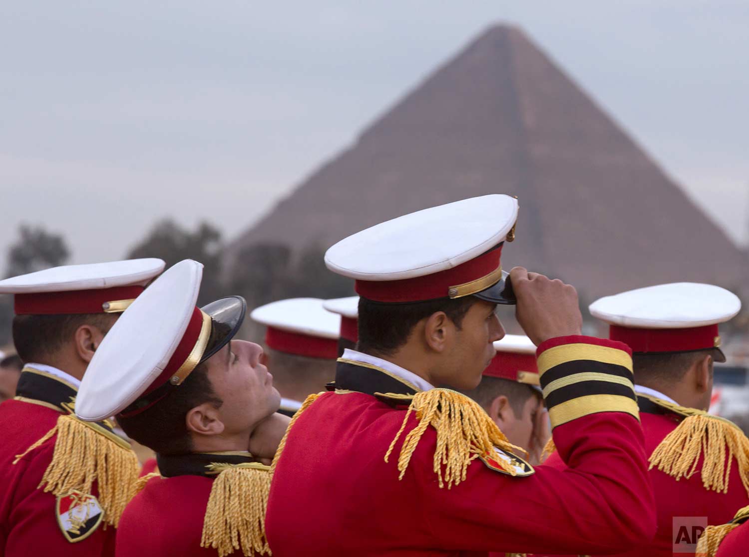 Honor guards prepare to participate in the placement of an ancient statue of Egyptian pharaoh Ramses II, at the entrance of the Grand Egyptian Museum, that is under construction near the Pyramids of Giza, outside Cairo, Egypt, Thursday, Jan. 25, 2018. (AP Photo/Amr Nabil)