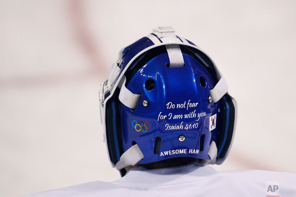  A Bible verse is written on the back of the joint Korean women's ice hockey team goalie Han Dohee's mask during a training session prior to the 2018 Winter Olympics in Gangneung, South Korea, Monday, Feb. 5, 2018. (AP Photo/Jae C. Hong) 