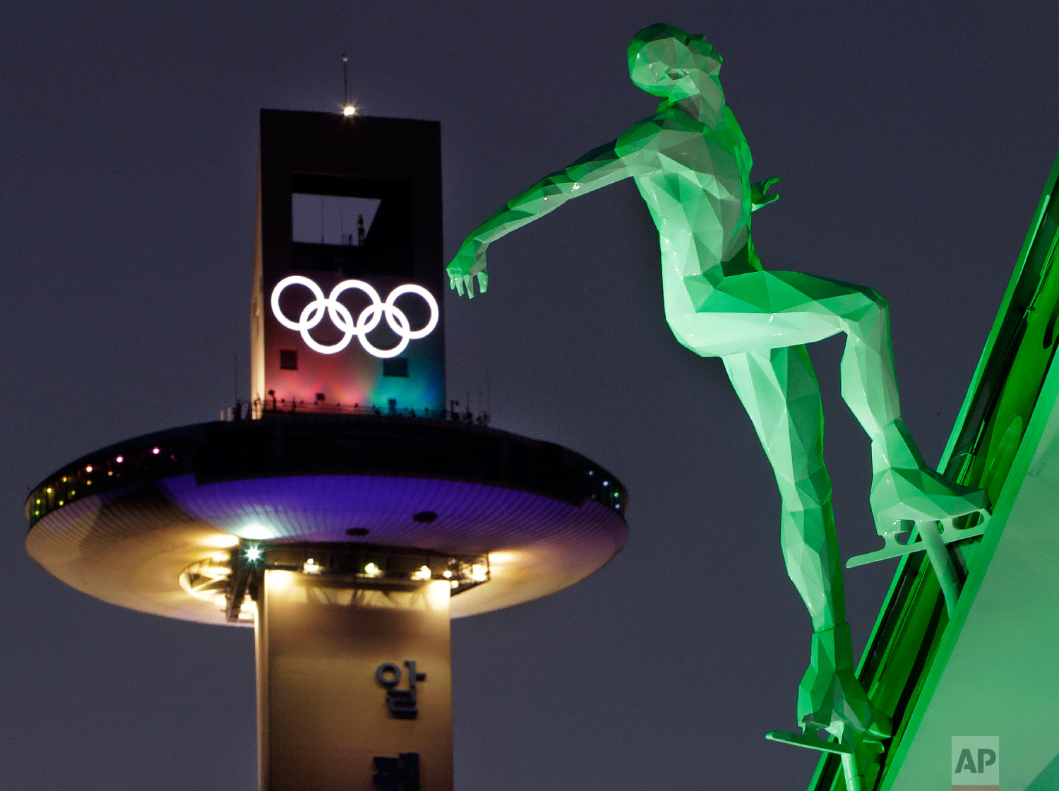  A speed skating figure is displayed in front of the Alpensia Ski Jumping Center ahead of the 2018 Winter Olympics in Pyeongchang, South Korea, Friday, Feb. 9, 2018. (AP Photo/Michael Probst) 