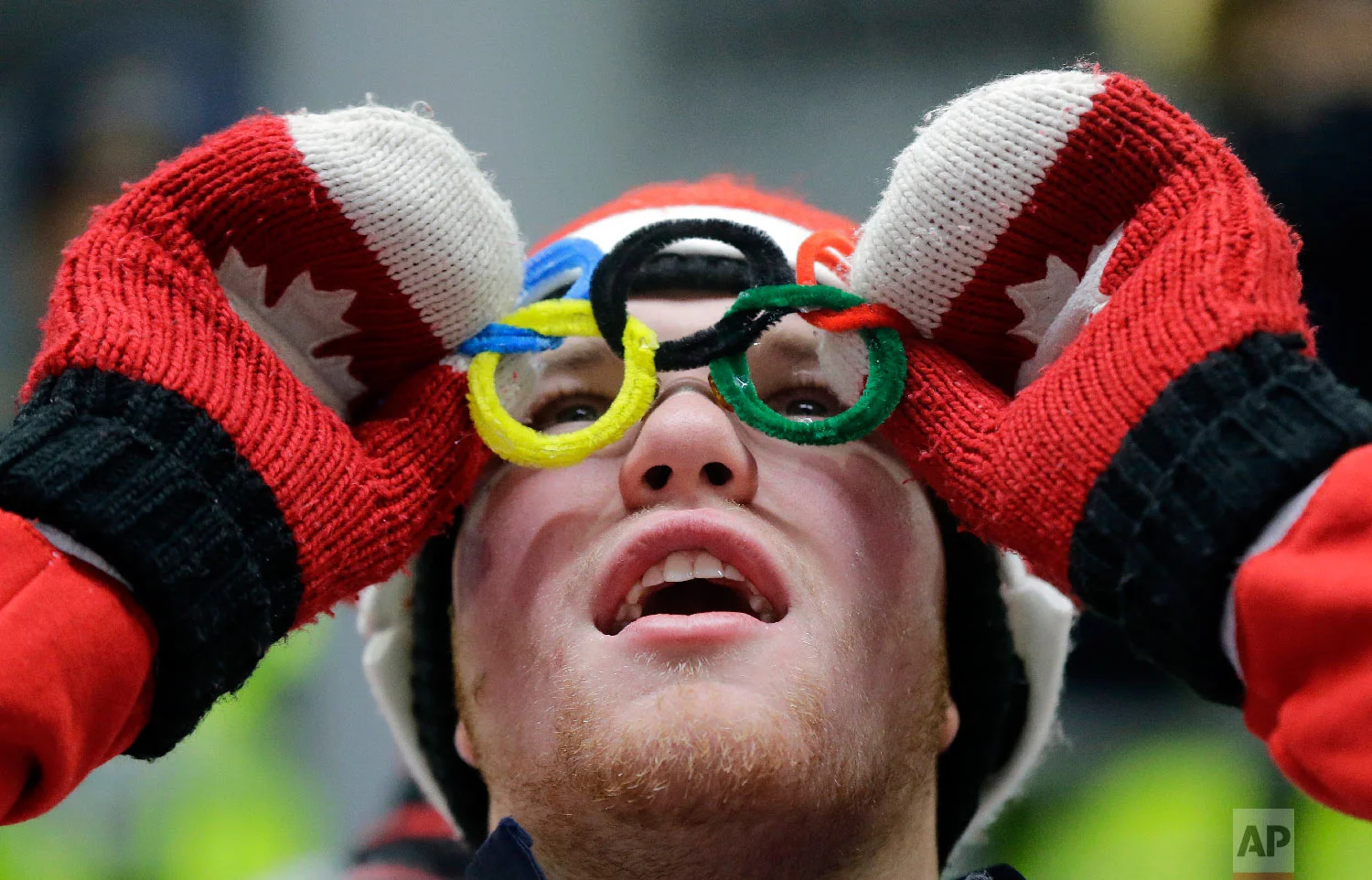 A Canadian fan watches the action during the men's luge at the 2018 Winter Olympics in Pyeongchang, South Korea, Saturday, Feb. 10, 2018. (AP Photo/Andy Wong)
