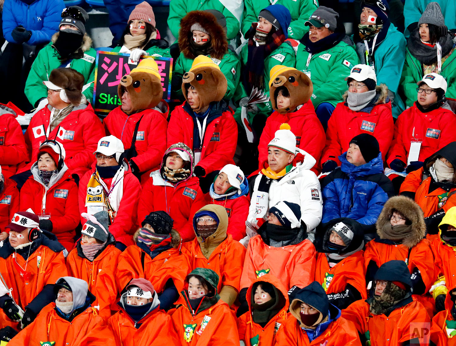  Fans watch during the women's normal hill individual ski jumping competition at the 2018 Winter Olympics in Pyeongchang, South Korea, Monday, Feb. 12, 2018. (AP Photo/Matthias Schrader) 