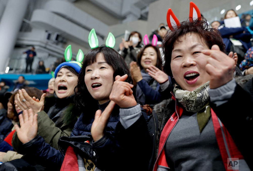  South Korea's fans cheer their team during a mixed doubles curling match against Olympic Athletes from Russia at the 2018 Winter Olympics in Gangneung, South Korea, Saturday, Feb. 10, 2018. (AP Photo/Natacha Pisarenko) 