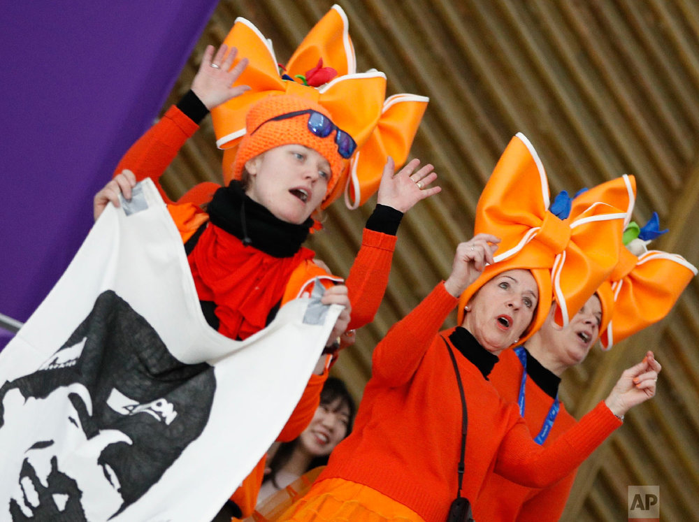  Fans clad in the colors of the Netherlands team hold a flag with the face of speed skater Sven Kramer of The Netherlands prior to the men's 5,000 meters race at the Gangneung Oval at the 2018 Winter Olympics in Gangneung, South Korea, Sunday, Feb. 1