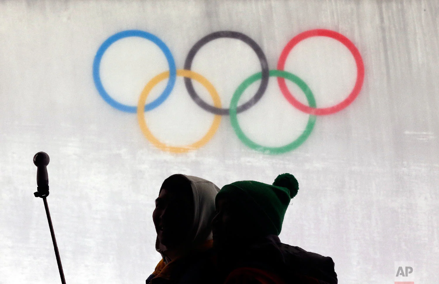 Fans take a photo during the men's luge at the 2018 Winter Olympics in Pyeongchang, South Korea, Saturday, Feb. 10, 2018. (AP Photo/Andy Wong)