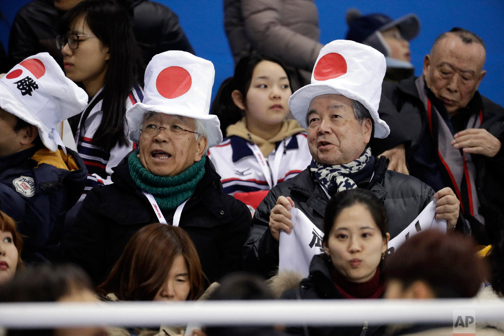  Japanese fans wait before the preliminary round of the women's hockey game between Switzerland and Japan at the 2018 Winter Olympics in Gangneung, South Korea, Monday, Feb. 12, 2018. (AP Photo/Julio Cortez) 