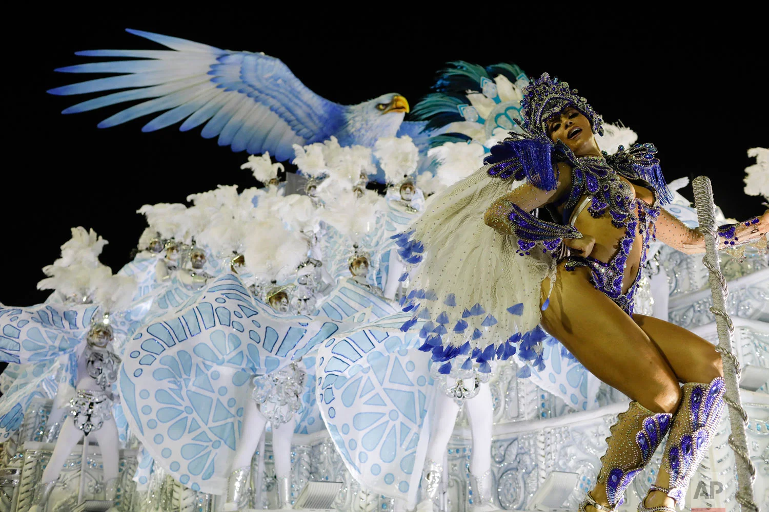 A performer from the Portela samba school parades on a float during Carnival celebrations at the Sambadrome in Rio de Janeiro, Brazil, Monday, Feb. 12, 2018. (AP Photo/Leo Correa)