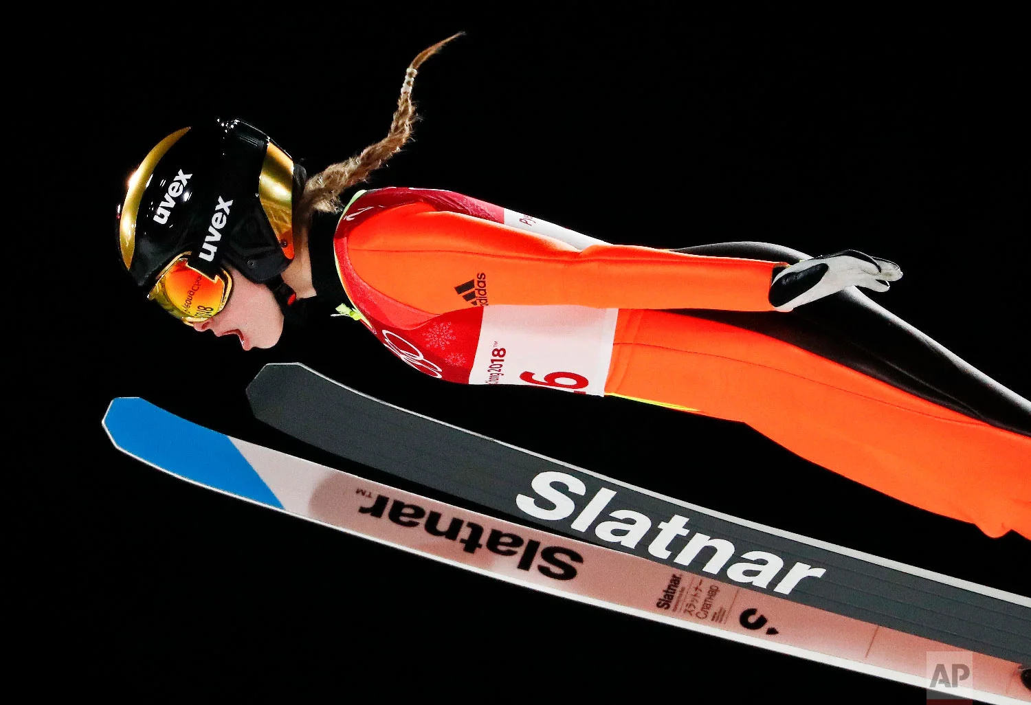 Nika Kriznar, of Slovenia, soars through the air during the women's normal hill individual ski jumping competition at the 2018 Winter Olympics in Pyeongchang, South Korea, Monday, Feb. 12, 2018. (AP Photo/Matthias Schrader)