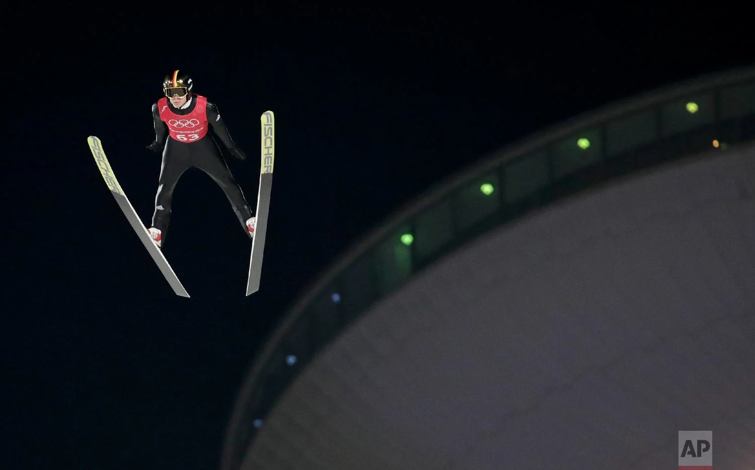 Andreas Wellinger, of Germany, soars through the air during training for the men's large hill individual ski jumping competition at the 2018 Winter Olympics in Pyeongchang, South Korea, Wednesday, Feb. 14, 2018. (AP Photo/Dmitri Lovetsky)