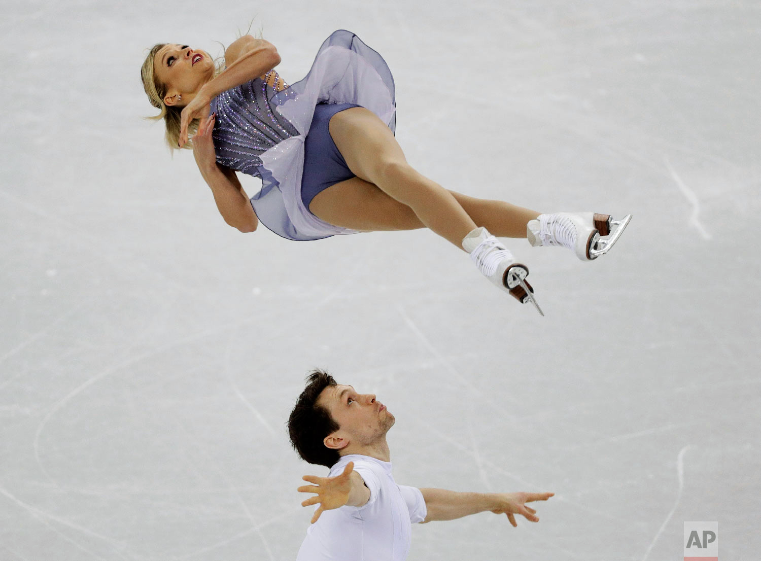  Kirsten Moore-Towers and Michael Marinaro, of Canada, perform in the pairs free skate figure skating final in the Gangneung Ice Arena at the 2018 Winter Olympics in Gangneung, South Korea, Thursday, Feb. 15, 2018. (AP Photo/David J. Phillip) 