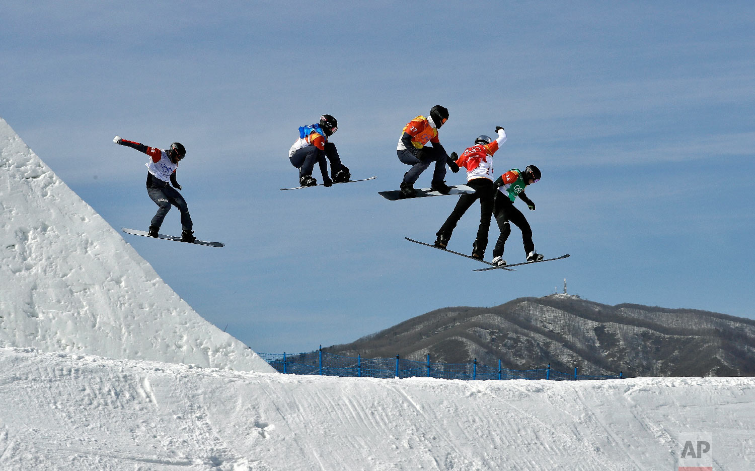  Form left; Lukas Pachner, of Austria, Jonathan Cheever, of the United States, Mick Dierdorff, of the United States, Regino Hernandez, of Spain, and Paul Berg, of Germany, run the course during the men's snowboard cross elimination round at Phoenix S