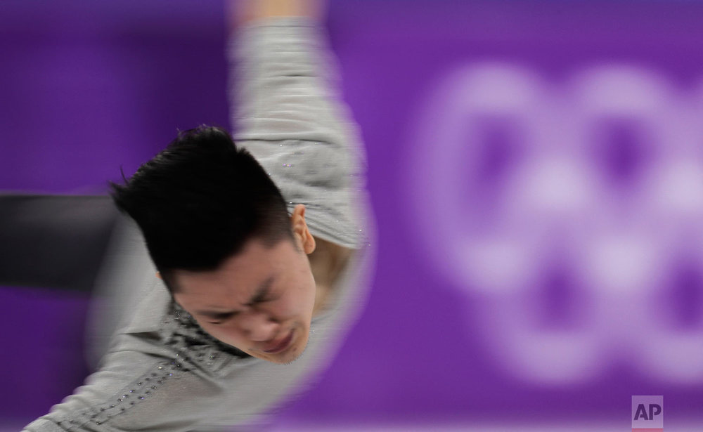  Yan Han of China performs during the men's short program figure skating in the Gangneung Ice Arena at the 2018 Winter Olympics in Gangneung, South Korea, Friday, Feb. 16, 2018. (AP Photo/Julie Jacobson) 