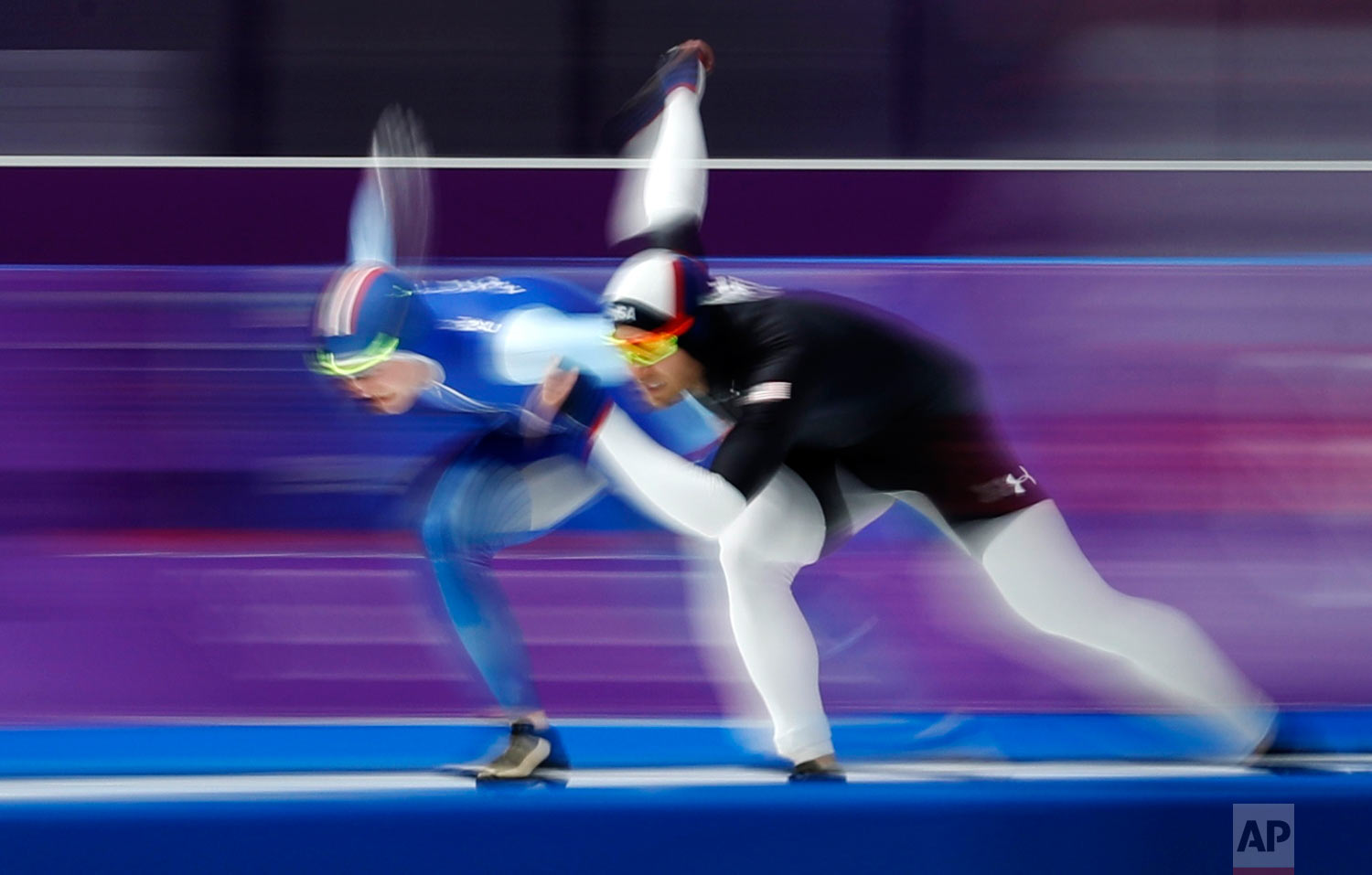 Joey Mantia of the U.S., right, and Norway's Sverre Lunde Pedersen compete during the men's 1,500 meters speedskating race at the Gangneung Oval at the 2018 Winter Olympics in Gangneung, South Korea, Tuesday, Feb. 13, 2018. (AP Photo/John Locher)