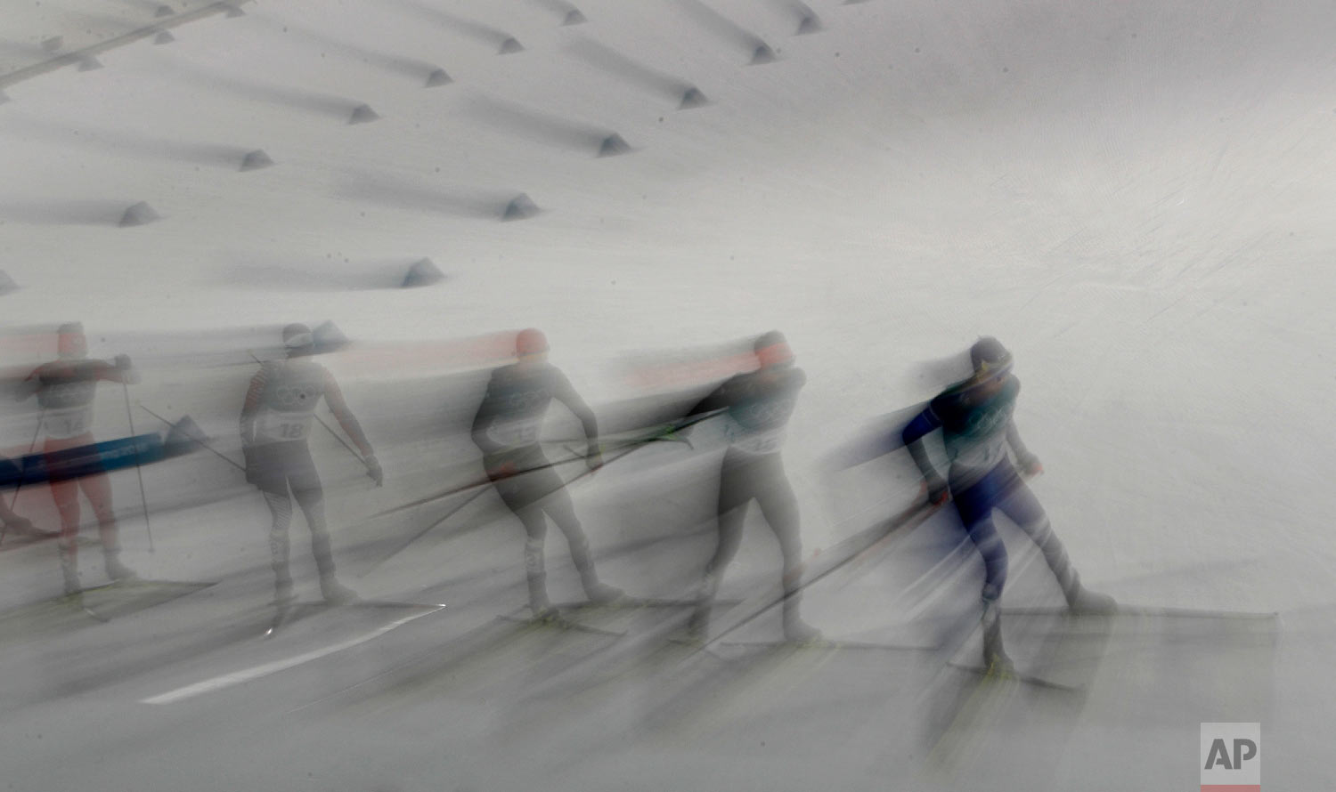 Athletes compete in the 10km cross-country skiing portion of the nordic combined event at the 2018 Winter Olympics in Pyeongchang, South Korea, Wednesday, Feb. 14, 2018. (AP Photo/Charlie Riedel)