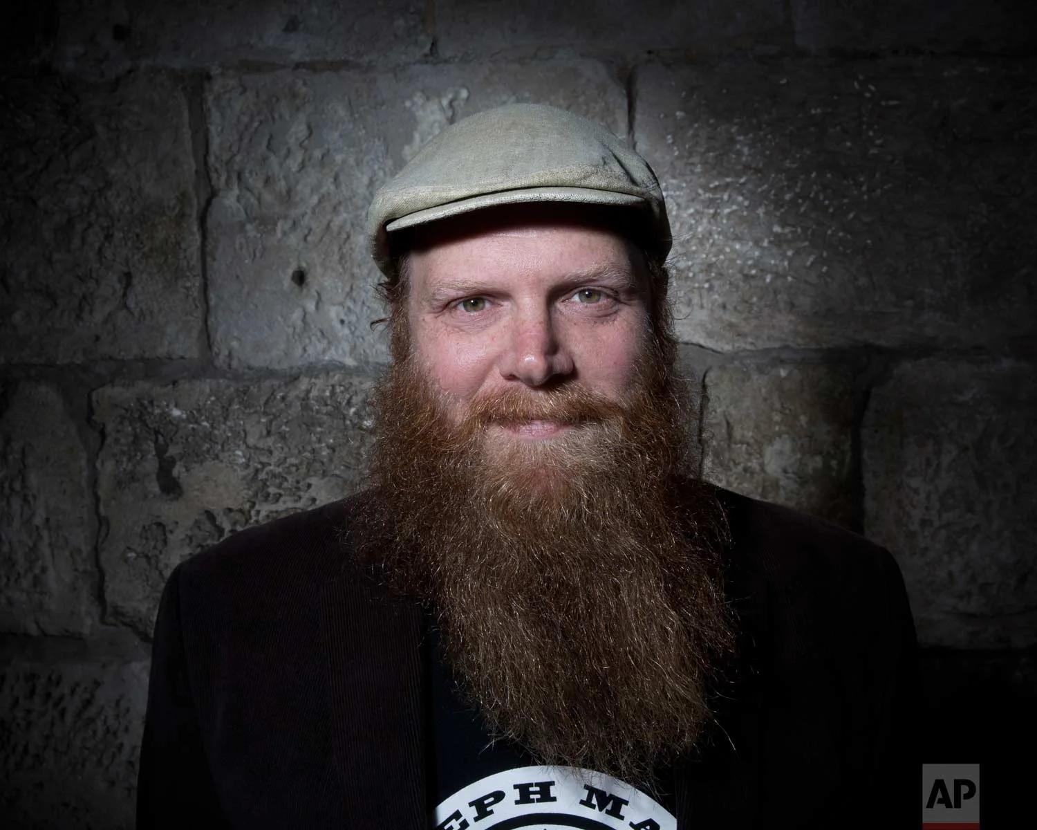 In this Sunday, Feb. 11, 2018 photo, Jewish Ultra-Orthodox Eitan Press of Aleph Male, a beard balm business poses for a portrait in Jerusalem's Old City. (AP Photo/Oded Balilty)