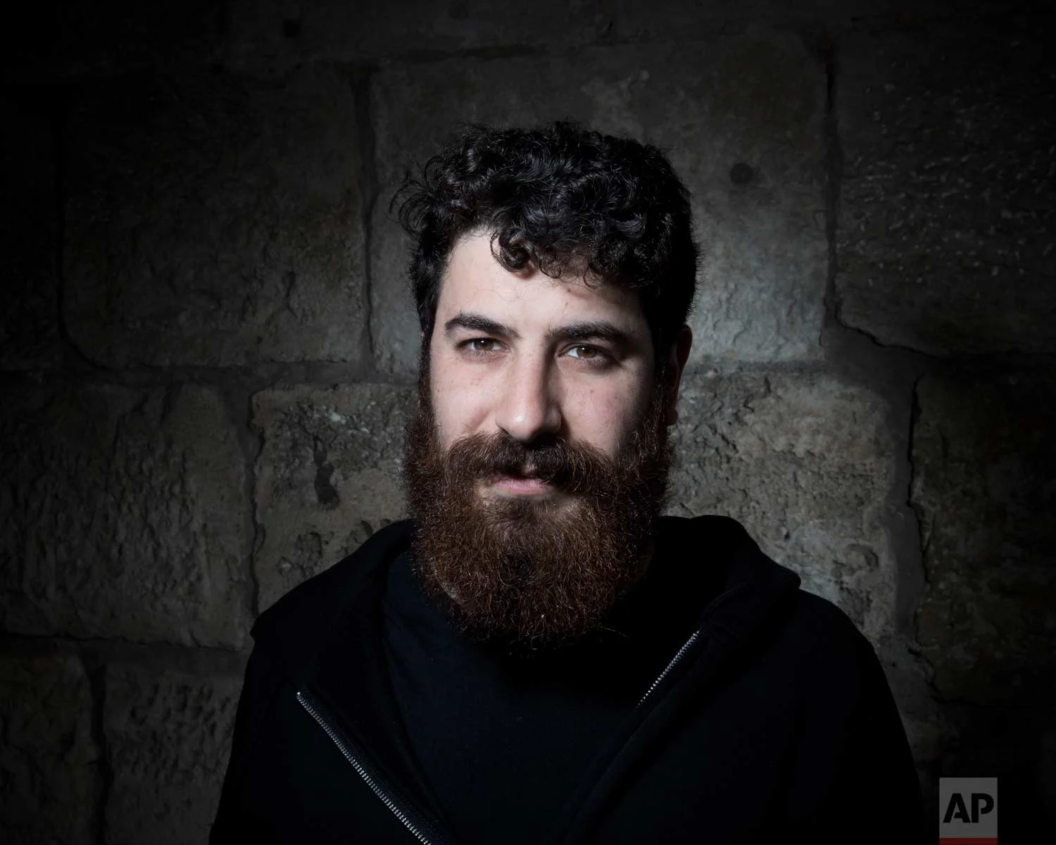 In this Sunday, Feb. 11, 2018 photo, Israeli Lenny Boss poses for a portrait in Jerusalem's Old City. (AP Photo/Oded Balilty)