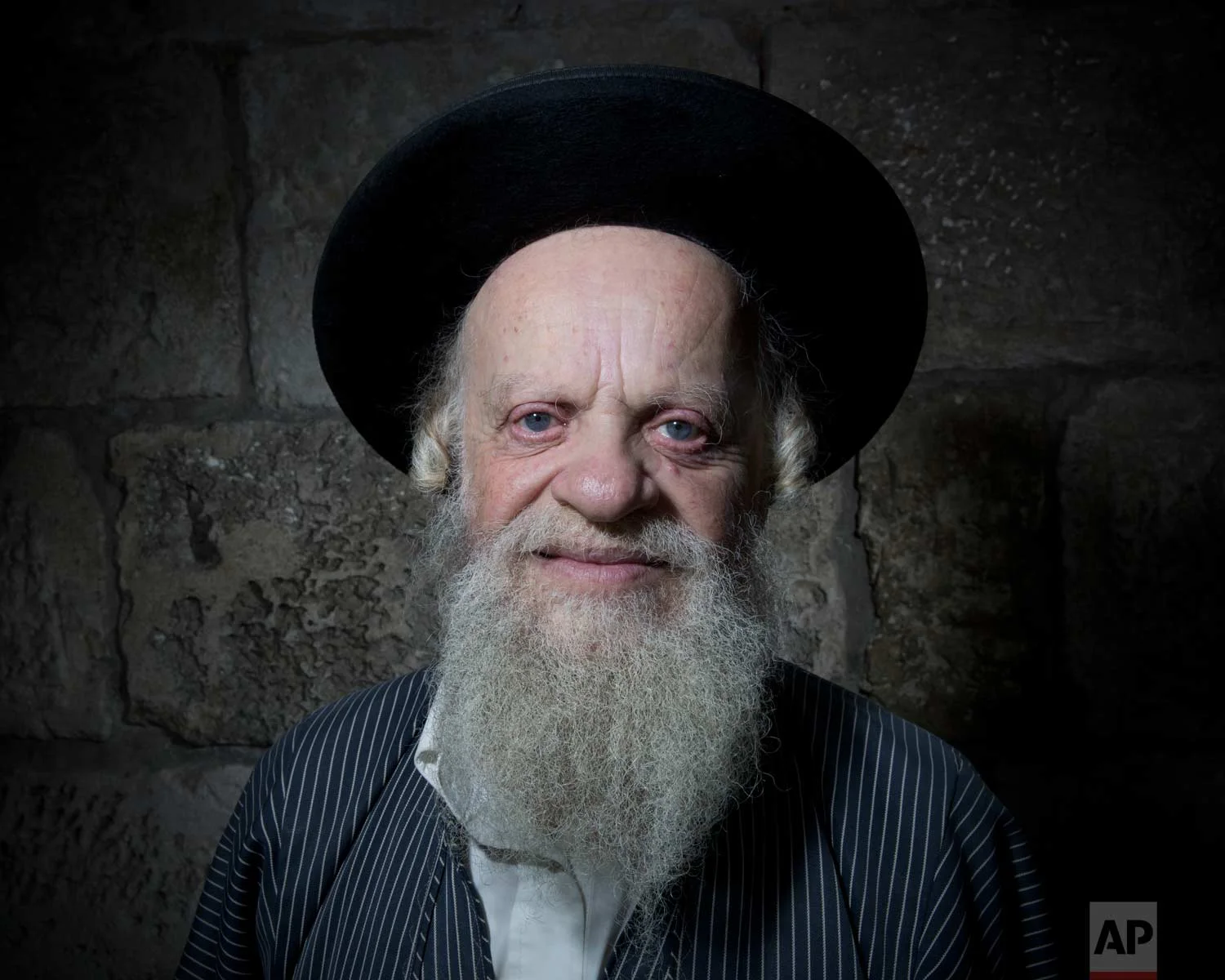 In this Sunday, Feb. 11, 2018 photo, Efraim Grois, a Jewish Ultra-Orthodox poses for a portrait in Jerusalem's Old City. (AP Photo/Oded Balilty)