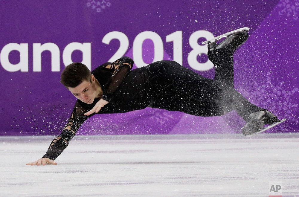  Yaroslav Paniot of Ukraine falls while performing in the men's short program figure skating in the Gangneung Ice Arena at the 2018 Winter Olympics in Gangneung, South Korea, Friday, Feb. 16, 2018. (AP Photo/David J. Phillip) 