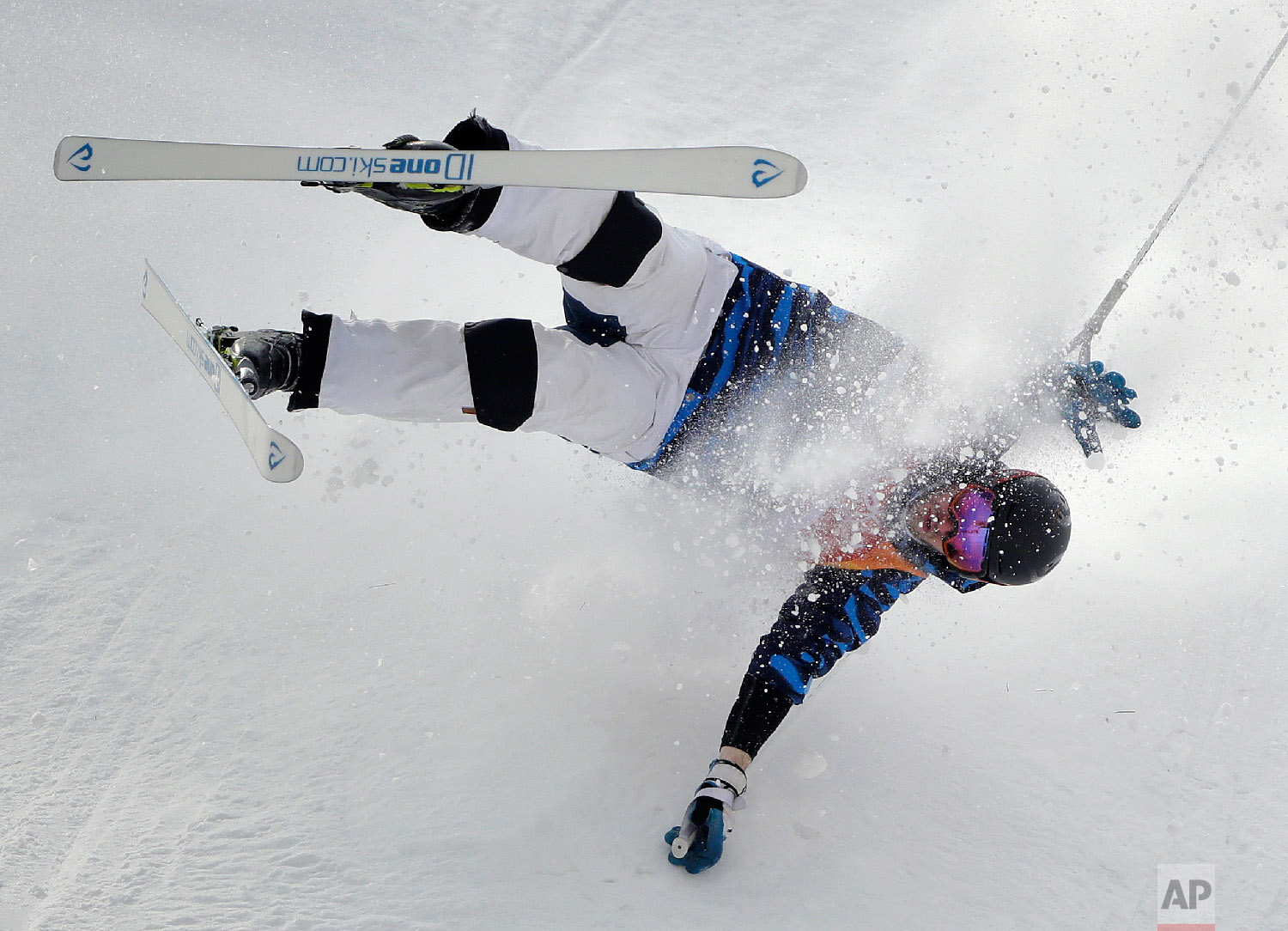  Jussi Penttala, of Finland, crashes during the men's moguls qualifying at Phoenix Snow Park at the 2018 Winter Olympics in Pyeongchang, South Korea, Friday, Feb. 9, 2018. (AP Photo/Gregory Bull) 