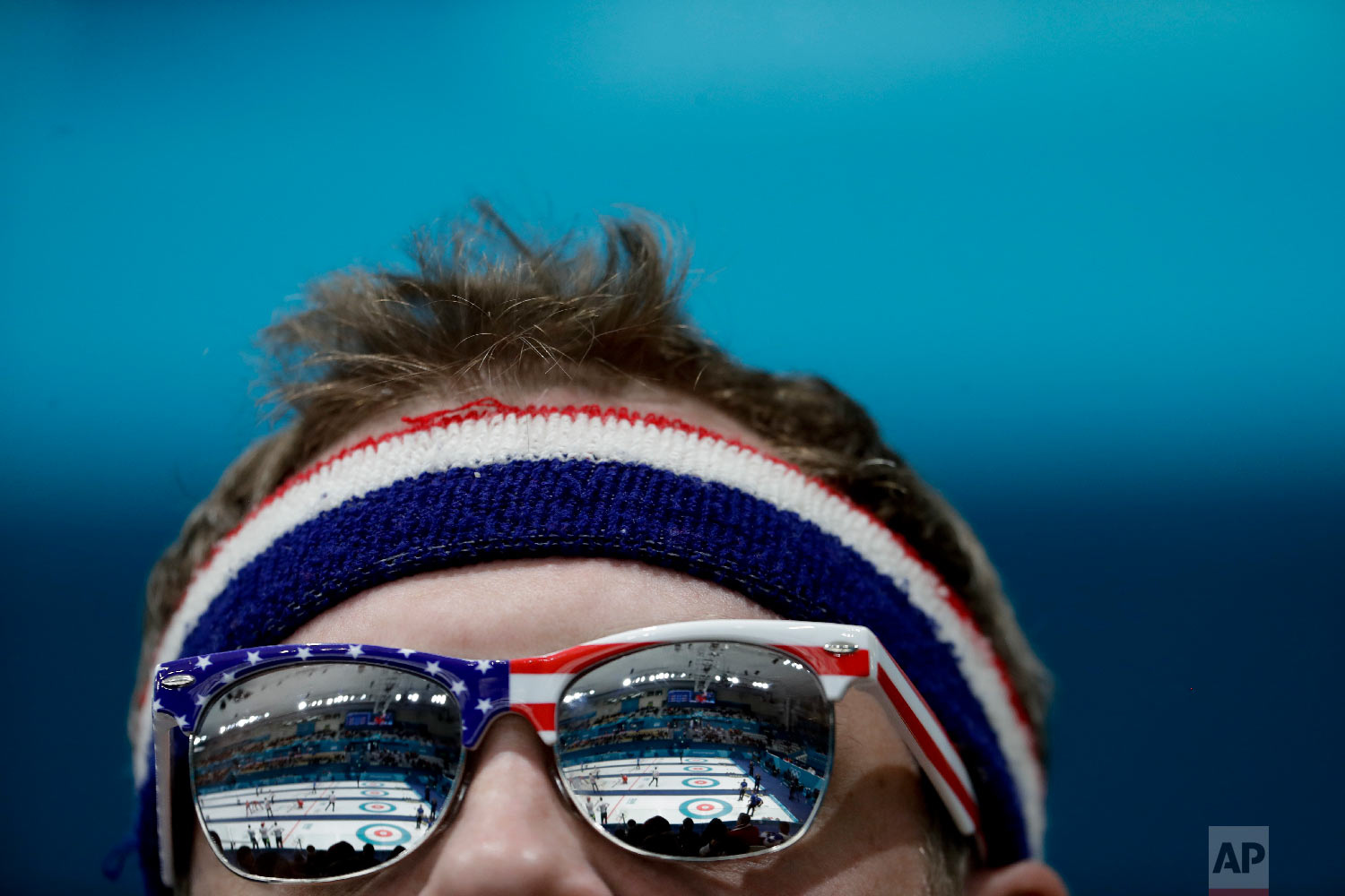  A fan from the United States watches men's curling matches at the 2018 Winter Olympics in Gangneung, South Korea, Friday, Feb. 16, 2018. (AP Photo/Natacha Pisarenko) 