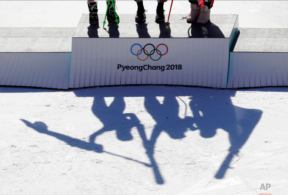  Austria's Anna Veith, silver, Czech Republic's Ester Ledecka, gold, and Liechtenstein's Tina Weirather, bronze, from left, celebrate during the venue ceremony for the women's super-G at the 2018 Winter Olympics in Jeongseon, South Korea, Saturday, F