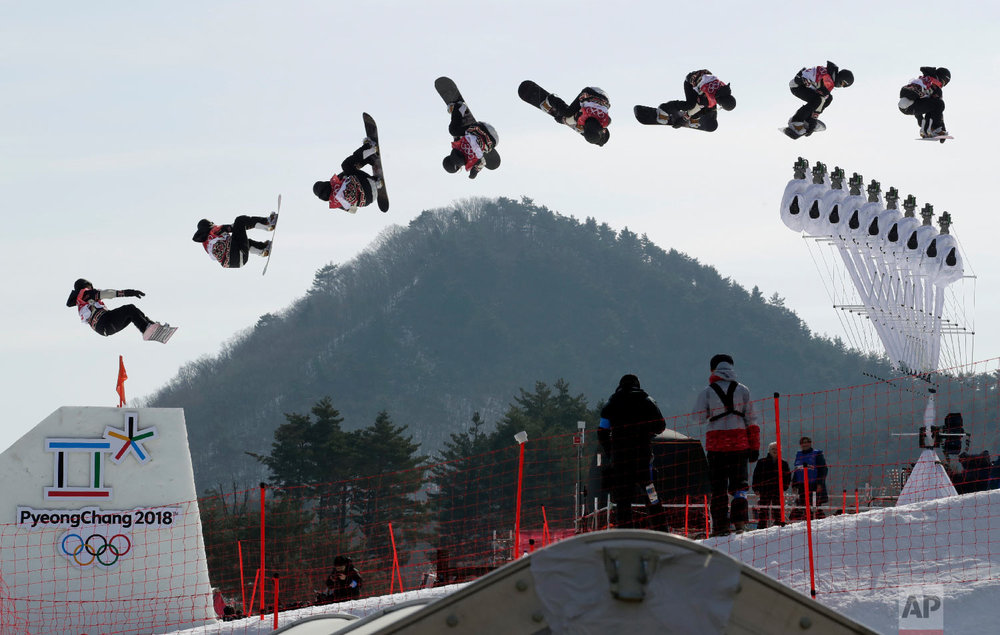 In this multiple exposure image Laurie Blouin, of Canada, jumps during qualification for the women's Big Air snowboard competition at the 2018 Winter Olympics in Pyeongchang, South Korea, Monday, Feb. 19, 2018. (AP Photo/Dmitri Lovetsky) 