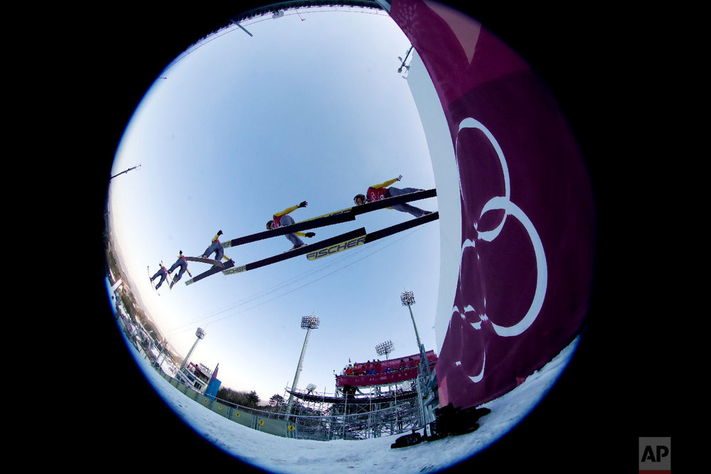  In this multiple exposure picture made through a fisheye lens shows Hannu Manninen, of Finland, jumping during training for the men's nordic combined competition at the 2018 Winter Olympics in Pyeongchang, South Korea, Tuesday, Feb. 13, 2018. (AP Ph