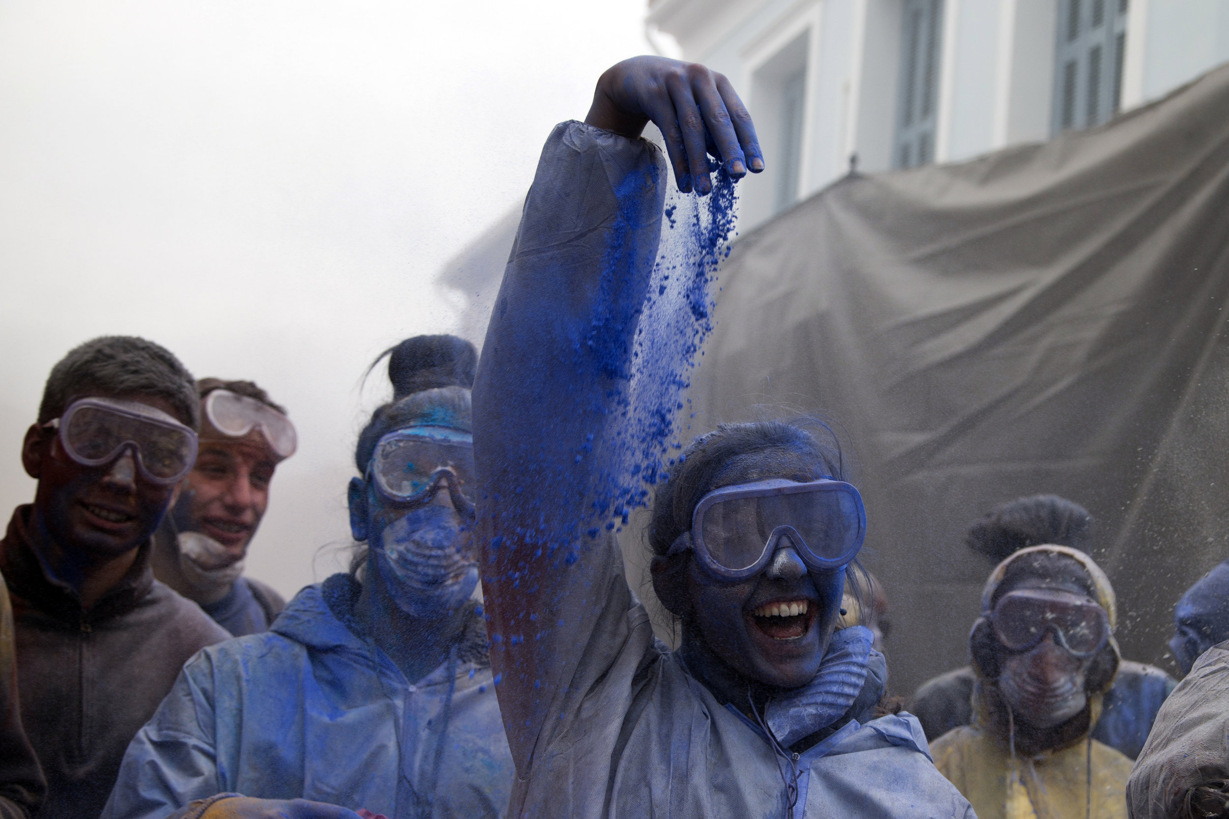 Revelers throw flour as they participate in the flour war, a unique colorful flour fight marking the end of the carnival season, in the port town of Galaxidi, some 200 kilometers (120 miles) west of Athens, Monday, Feb. 19, 2018. (AP Photo/Petros Gi