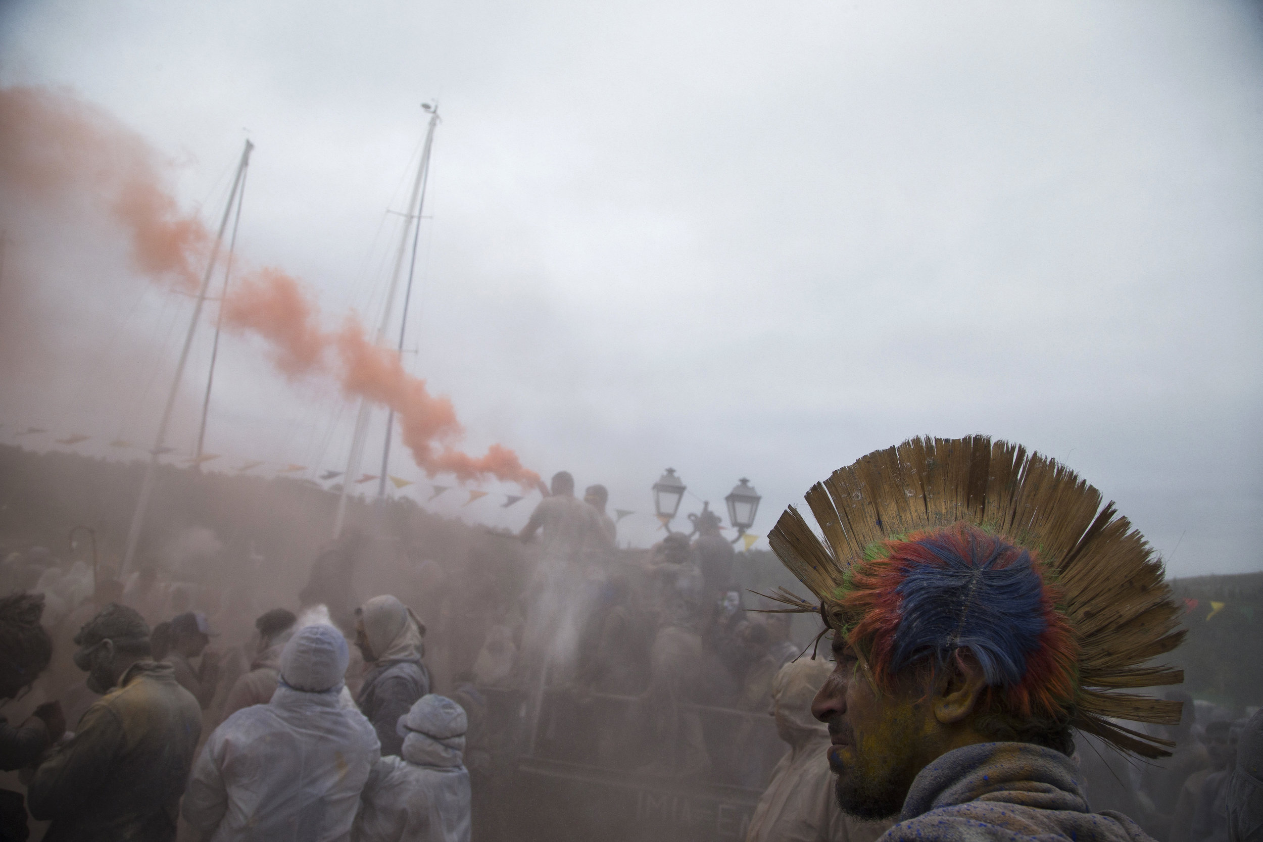  In this Monday, Feb. 19, 2018 photo, revelers take part in the flour war, a unique colorful flour fight marking the end of the carnival season in the port town of Galaxidi, some 200 kilometers (120 miles) west of Athens.  (AP Photo/Petros Giannakour