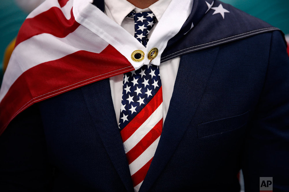  Patrick Kearney wears an American flag as a cape during the quarterfinal round of the men's hockey game between the United States and the Czech Republic at the 2018 Winter Olympics in Gangneung, South Korea, Wednesday, Feb. 21, 2018. (AP Photo/Jae C