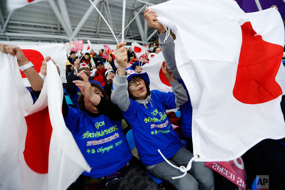  Spectators wave the national flag of Japan during the women's 1,000 meters speedskating race at the Gangneung Oval at the 2018 Winter Olympics in Gangneung, South Korea, Wednesday, Feb. 14, 2018. (AP Photo/John Locher) 