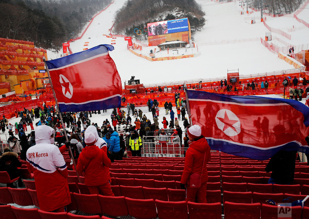  North Korean fans wave flags at the women's slalom at Yongpyong alpine center at the 2018 Winter Olympics in Pyeongchang, South Korea, Wednesday, Feb. 14, 2018. (AP Photo/Christophe Ena) 